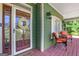 Welcoming front porch with comfortable seating and a decorative wreath at 940 Planters Pl, Loganville, GA 30052