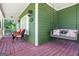Cozy front porch featuring a porch swing and comfortable chairs at 940 Planters Pl, Loganville, GA 30052