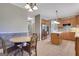 Spacious kitchen with a dining area, wood cabinets, and stainless steel refrigerator at 940 Planters Pl, Loganville, GA 30052