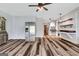 Open floor plan kitchen with wood floors, stainless fridge and custom accents at 940 Planters Pl, Loganville, GA 30052