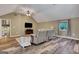 Bright living room features vaulted ceiling, ceiling fan, and hardwood style floors at 940 Planters Pl, Loganville, GA 30052