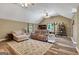 Bright living room features vaulted ceiling, ceiling fans, and hardwood style floors at 940 Planters Pl, Loganville, GA 30052