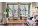 Bright living room with hardwood floors and large windows at 940 Planters Pl, Loganville, GA 30052