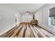 Open-concept living room with hardwood floors, lots of natural light, and neutral paint at 940 Planters Pl, Loganville, GA 30052