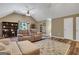 Bright living room features vaulted ceiling, ceiling fan, and hardwood style floors at 940 Planters Pl, Loganville, GA 30052