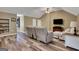 Cozy living room features vaulted ceiling, ceiling fan, and wood-look floors at 940 Planters Pl, Loganville, GA 30052