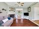 Cozy living room with a brick fireplace and open dining area at 940 Planters Pl, Loganville, GA 30052