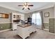 Home office featuring built-in shelving, a large desk, and neutral carpeting at 940 Planters Pl, Loganville, GA 30052