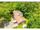 Aerial view of a property with a large roof and green trees at 258 Big Oak Rd, Whitesburg, GA 30185
