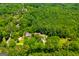 Lush greenery surrounds a secluded house, showcasing the property's serene and private location at 258 Big Oak Rd, Whitesburg, GA 30185