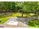 Aerial view of the backyard with a shed and driveway at 258 Big Oak Rd, Whitesburg, GA 30185