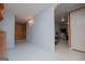 Unfinished basement with painted floors, wood-paneled wall and open entry to storage area at 258 Big Oak Rd, Whitesburg, GA 30185