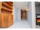 Finished basement with painted floors, wood-paneled wall and built-in storage at 258 Big Oak Rd, Whitesburg, GA 30185