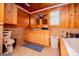 Bathroom with a toilet, tile flooring, wood paneled walls, and a vanity with large mirror at 258 Big Oak Rd, Whitesburg, GA 30185