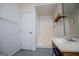 Simple bathroom featuring single sink vanity, a shower and white walls at 258 Big Oak Rd, Whitesburg, GA 30185