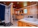 Well-lit bathroom features tiled walls, wood paneling, walk-in shower, and a soaking tub at 258 Big Oak Rd, Whitesburg, GA 30185