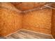 Walk-in closet with wood paneled walls, vinyl floors and custom adjustable wire shelving at 258 Big Oak Rd, Whitesburg, GA 30185