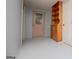 Basement entryway with decorative glass door and built-in storage at 258 Big Oak Rd, Whitesburg, GA 30185