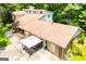 Aerial view showcasing the roof, patio, and surrounding greenery of this beautiful home at 258 Big Oak Rd, Whitesburg, GA 30185
