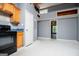 Open kitchen area featuring ample natural light, wood cabinetry and white floors at 258 Big Oak Rd, Whitesburg, GA 30185