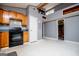 Well-lit kitchen showcases light wood cabinets, black appliances, and gray walls at 258 Big Oak Rd, Whitesburg, GA 30185