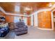 Comfortable living room featuring wood paneled walls, carpet and comfortable seating at 258 Big Oak Rd, Whitesburg, GA 30185