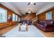 Open living room with hardwood floors, comfortable furniture, and stairs to the upper level at 258 Big Oak Rd, Whitesburg, GA 30185