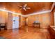 Bright living room with hardwood floors and an appliance hidden behind wooden sliding doors at 258 Big Oak Rd, Whitesburg, GA 30185