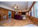 Bright living room with a fireplace, hardwood floors, and multiple windows for natural light at 258 Big Oak Rd, Whitesburg, GA 30185