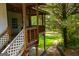 View of a wooden porch with stairs, showcasing the outdoor space at 258 Big Oak Rd, Whitesburg, GA 30185