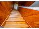 Wooden stairs with wooden paneled walls lead to the second level of this house at 258 Big Oak Rd, Whitesburg, GA 30185