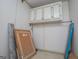 Unfinished storage with plain cabinets and flooring at 258 Big Oak Rd, Whitesburg, GA 30185