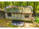 Durable shed with a shingled roof set amid lush greenery, ideal for secure storage at 258 Big Oak Rd, Whitesburg, GA 30185