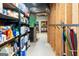 Storage basement showing exposed pipes, shelves, and a work in progress at 165 Longshore Way, Fayetteville, GA 30215