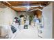 Unfinished basement ready for customization and featuring a refrigerator and exposed beams at 165 Longshore Way, Fayetteville, GA 30215