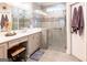 Updated bathroom with dual vanities, a glass-enclosed shower, and modern fixtures at 165 Longshore Way, Fayetteville, GA 30215