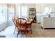 Sunlit dining area boasts a breakfast nook and backyard view at 165 Longshore Way, Fayetteville, GA 30215