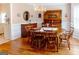 Formal dining room with hardwood floors, wainscoting, and a classic chandelier at 165 Longshore Way, Fayetteville, GA 30215