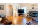 Comfortable living room featuring a fireplace, hardwood floors, and recessed lighting at 165 Longshore Way, Fayetteville, GA 30215