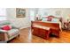 Warm and inviting bedroom with a large sleigh bed, warm paint, and hardwood floors at 165 Longshore Way, Fayetteville, GA 30215