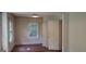 Bright bedroom features a large window and hardwood floors at 2916 Memorial Se Dr, Atlanta, GA 30317