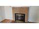 Living room featuring a brick fireplace with black metal screen at 2916 Memorial Se Dr, Atlanta, GA 30317