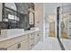 Elegant bathroom featuring double vanity, decorative mirrors, and luxurious walk-in shower at 1240 Hayes Sq, Peachtree City, GA 30269