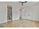 Bedroom with neutral walls, hardwood floors and a bathroom with glass door at 1240 Hayes Sq, Peachtree City, GA 30269