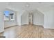Bright bedroom featuring hardwood floors, pitched ceiling, and a large window overlooking the neighborhood at 1240 Hayes Sq, Peachtree City, GA 30269