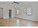 Spacious bedroom featuring hardwood floors, natural light, and an en suite bathroom at 1240 Hayes Sq, Peachtree City, GA 30269