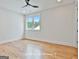 Bright bedroom with hardwood floors, a ceiling fan, and a view from the window at 1240 Hayes Sq, Peachtree City, GA 30269