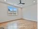 Bedroom with hardwood floors and a large window providing ample natural light at 1240 Hayes Sq, Peachtree City, GA 30269