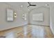 Bright bedroom with vaulted ceilings, hardwood floors, and modern lighting fixtures at 1240 Hayes Sq, Peachtree City, GA 30269