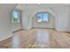 Large bonus room featuring wood floors and natural light from large windows at 1240 Hayes Sq, Peachtree City, GA 30269